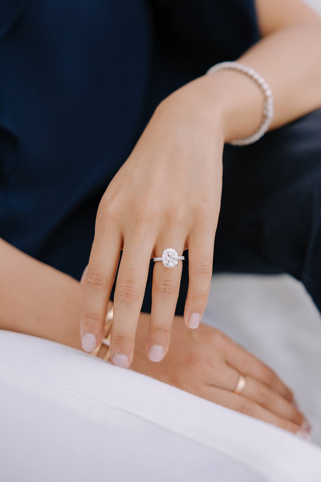 Close-up of an engagement ring on her hand, moments after the proposal